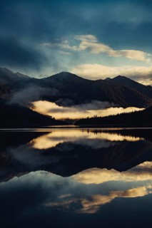 Sunrise with reflections in the Plansee in Tyrol in the Alps in Austria