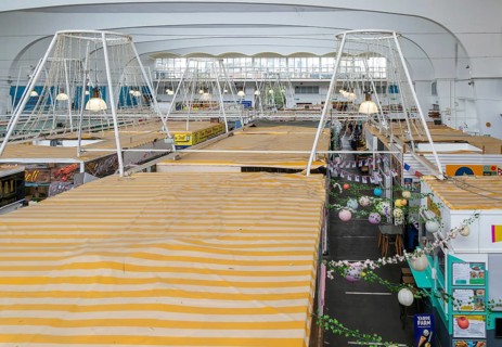 Raised view over roofs of market stalls in Market Building or Pannier Market, city of Plymouth,
