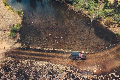 Landrover crosses river in Australian outback in the Kimberley, North West Australia, Australia