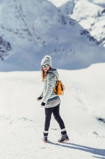 Woman in wintry surroundings in the Engadine in Switzerland