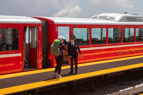 Colorado Springs, Colorado - A conductor talks with a passenger after the Manitou and Pikes Peak