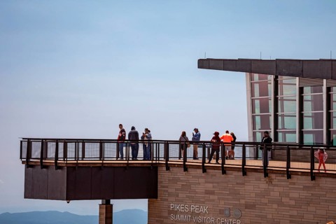 Colorado Springs, Colorado - Tourists on the viewing platform at the Pikes Peak Summit Visitor