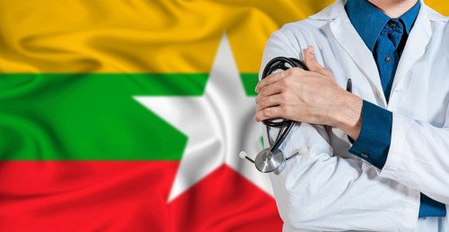 Doctor with stethoscope on Myanmar flag. Doctor holding stethoscope on Myanmar flag