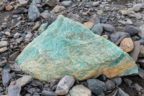Melting glacier, copper-bearing stone, Cooper Camp, Spitsbergen, Svalbard