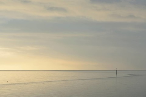 Wadden Sea at rising water, stone groyne with sea mark, North Sea, Norddeich, Lower Saxony, Germany
