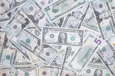 Various US dollar notes in a pile, banknotes