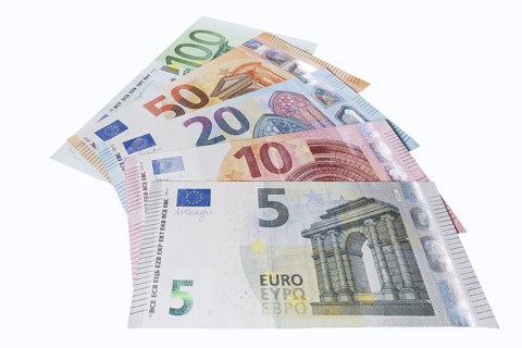 Various euro banknotes on white background, 5 euro, 10 euro, 20 euro, 50 euro, 100 euro