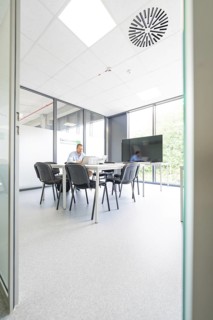 Modern conference room with large table, chairs and large windows, Care Connect, vaccination kiosk