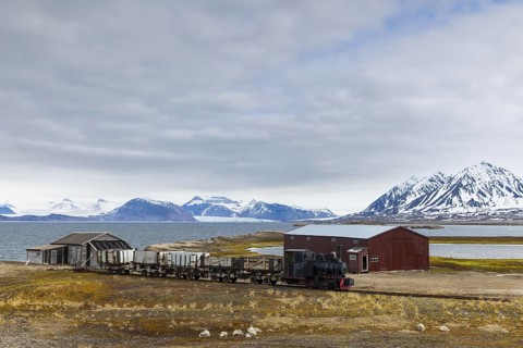 Historic steam locomotive, coal transport railway, mountain scenery, Ny-Alesund, Spitsbergen,