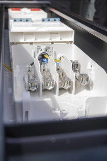 Detailed image of connections in an electrical device, assembly of a charging station for electric