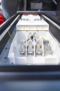 Close-up of electrical connections in a housing, assembly of a charging station for electric cars,