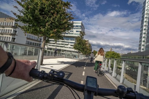 Cycling over the Moreelsebrug, pedestrian and cyclist bridge over the tracks of Utrecht Centraal,