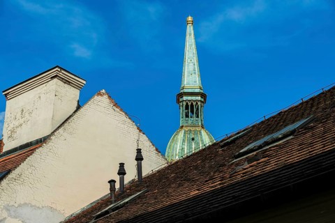 House roofs in the old town, in the background the tower of St Martin's Cathedral in Bratislava,