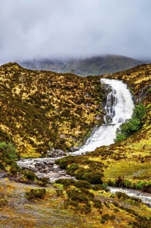 Eas a' Bhradain waterfall, Red Cuillin mountains, Loch Ainort, Isle of Skye, Scotland, UK