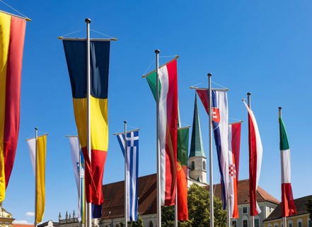 National flags at Kapellplatz with the collegiate parish church of St Philip and St James, place of