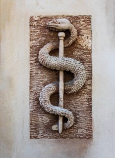 Aesculapian staff, apothecary symbol on a house wall, place of pilgrimage, Altötting, Upper