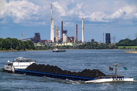 Industrial scenery of the ThyssenKrupp Steel steelworks in Duisburg-Bruckhausen, cargo ships on the