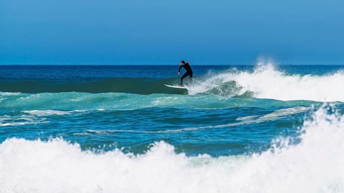 Surfer riding a wave on Contis beach, Saint Julien en Born, Saint-Julien-en-Born, Landes, France