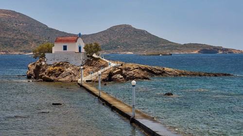 Whitewashed chapel with red roof on island in blue sea under sunny sky, chapel, church, Agios