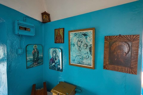 A room decorated with icons and blue-painted walls inside the church, chapel, church, Agios