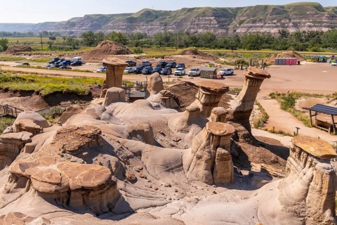 Breathtaking panorama featuring unique hoodoo rock formations in drumheller valley, highlighting