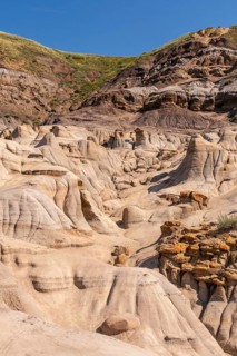 Breathtaking view of the arid landscape featuring unique hoodoo rock formations rising from the