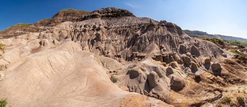 Panoramic view of unique hoodoo rock formations in drumheller, alberta, showcasing the geological