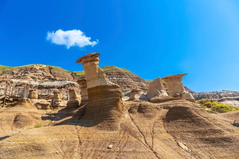 Breathtaking hoodoo rock formations dominate the arid landscape of drumheller, canada, under a