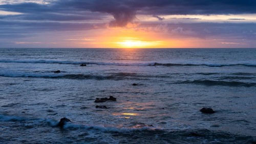 Sea in the evening at sunset, west coast of the Taranaki region, North Island, New Zealand