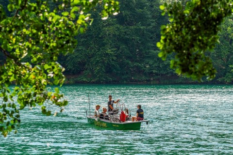 Manually operated ferry with ferryman and passengers, Lake Schmaler Luzin, Feldberg Lake District,