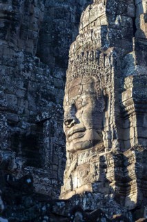 Huge stone-carved face of Bodhisattva Lokeshvara, also Avalokiteshvara, Bayon Temple, Angkor Thom,