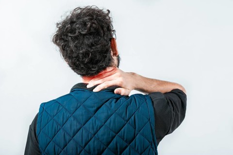 Close up of person with neck pain. Concept of people with stress and neck pain