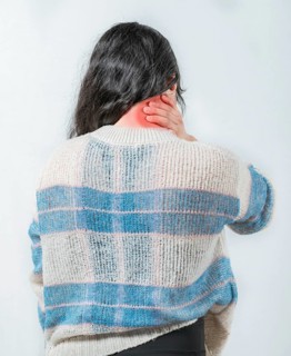 Suffering young woman with stress and neck pain. Close up female with neck pain. Woman in pain