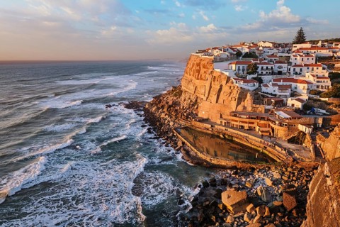 Scenic view of the seaside Azenhas do Mar fishing village on cliff on Atlantic ocean coast,