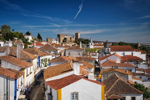 Stunning aerial view of Obidos, a medieval town in Portugal, showcasing its castle, city walls, and