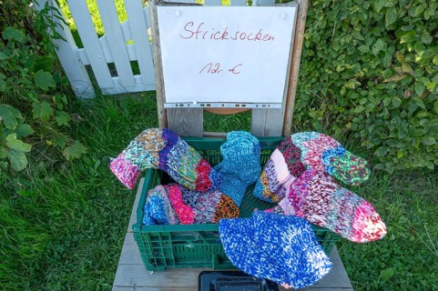 Sales stand with knitted socks on a path on the Bodden, Ahrenshoop, DarÃŸ, Mecklenburg-Western
