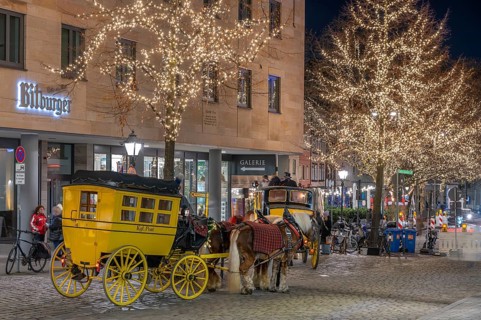 Historic stagecoach rides with horseback during the Nuremberg Christmas Market, Nuremberg, Middle