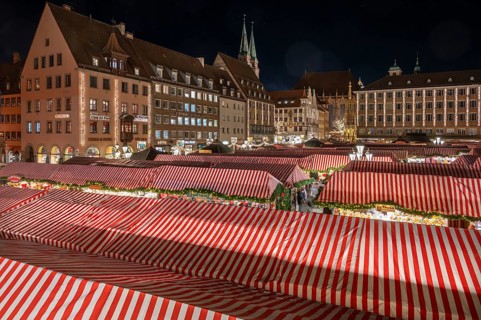 Nuremberg Christmas Market illuminated in the evening with the Beautiful Fountain, Town Hall and