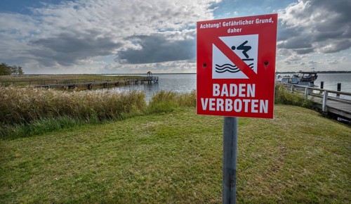 Sign bathing prohibited in the port of Wustrow, DarÃŸ, Mecklenburg, Western Pomerania, Germany