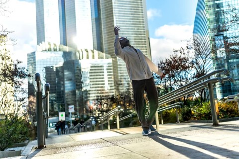 Man finding personal freedom and expressing himself through expressive urban dancing on a public