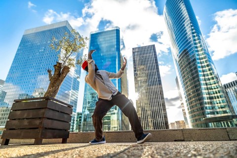 African american man performing contemporary dance in la defense urban plaza, full length