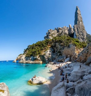 Light blue clear sea on a dream beach on Cala GoloritzÃ©, picturesque rocky coast, steep coast with
