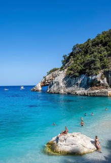 Light blue clear sea on a dream beach on Cala GoloritzÃ©, picturesque rocky coast, cliffs with rock