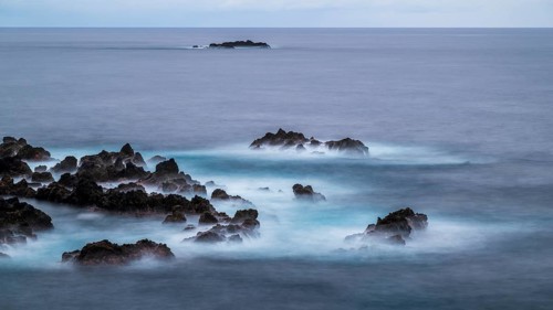 Sunset, long exposure, waves and rocks, coast near Porto Moniz, Madeira, Portugal