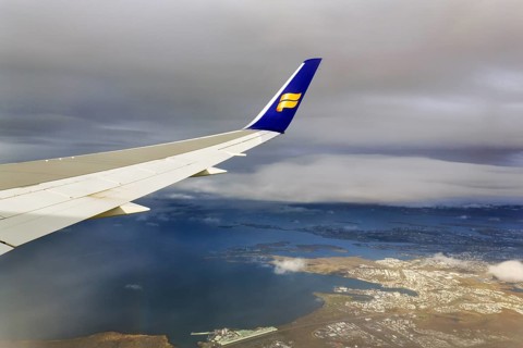 Wing, airplane, Icelandair airline logo, flying to Boston, view of Reykjavik, aerial view, Iceland