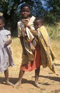 Girl carrying a toddler, Bwangu Mzimba, Malawi, Africa, June 2000, vintage, retro, old, historic