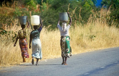 Women balancing baskets on their heads, Bwangu Mzimba, Malawi, Africa, June 2000, vintage, retro,