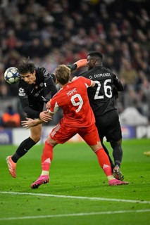 Header duel One-on-one action Harry Kane FC Bayern Munich FCB (09) v Joao Simoes Sporting Lisbon