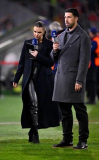 DAZN presenter Laura Wontorra in leather outfit and TV expert Sami Khedira with microphone, logo,