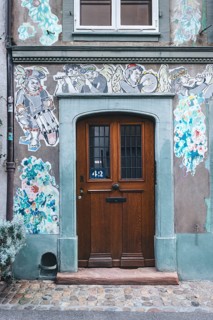 House faÃ§ade with paste-up street art, Basel